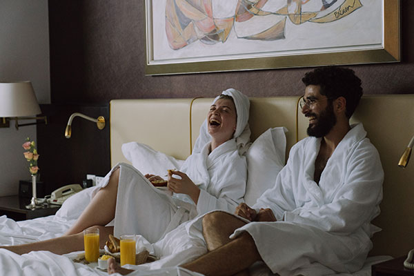 Couple In Bed With Breakfast
