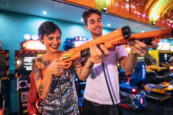 First Date Ideas - Gaming at Arcade Couple