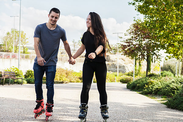 First Date Ideas - Rollerblading Couple