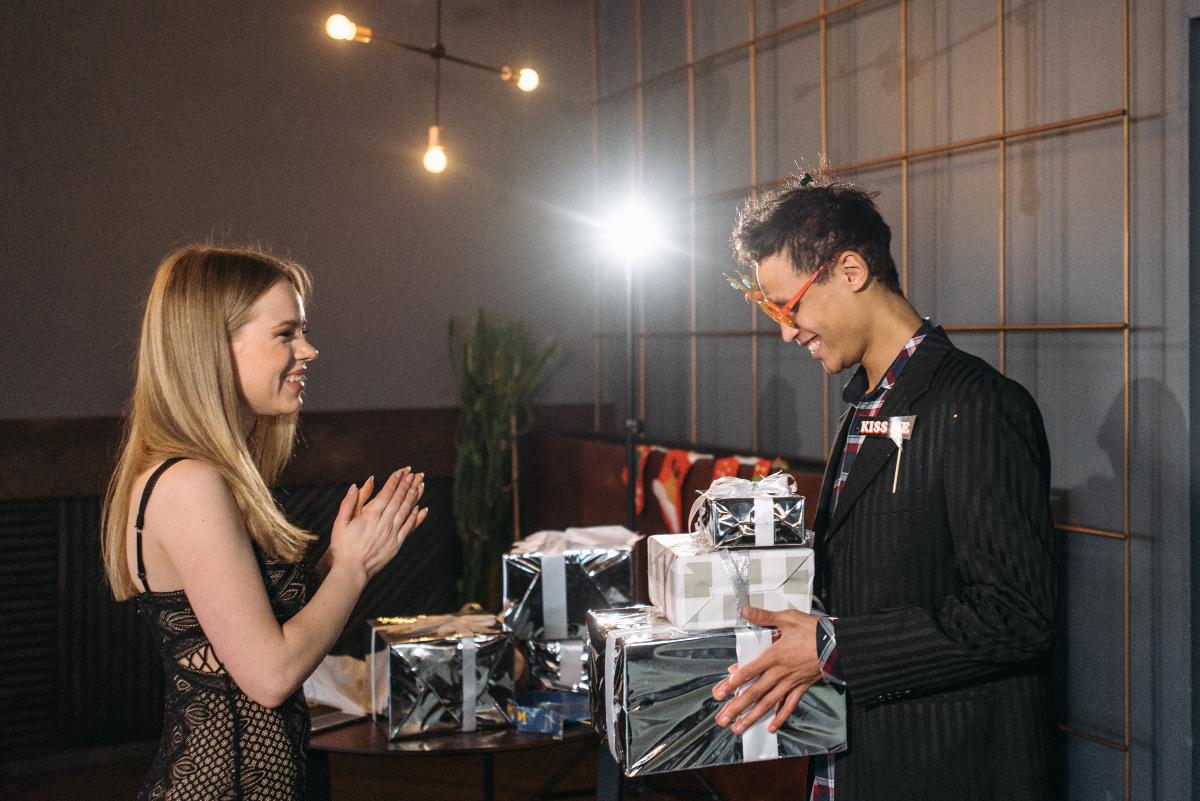 Man Giving Gifts To Girlfriend